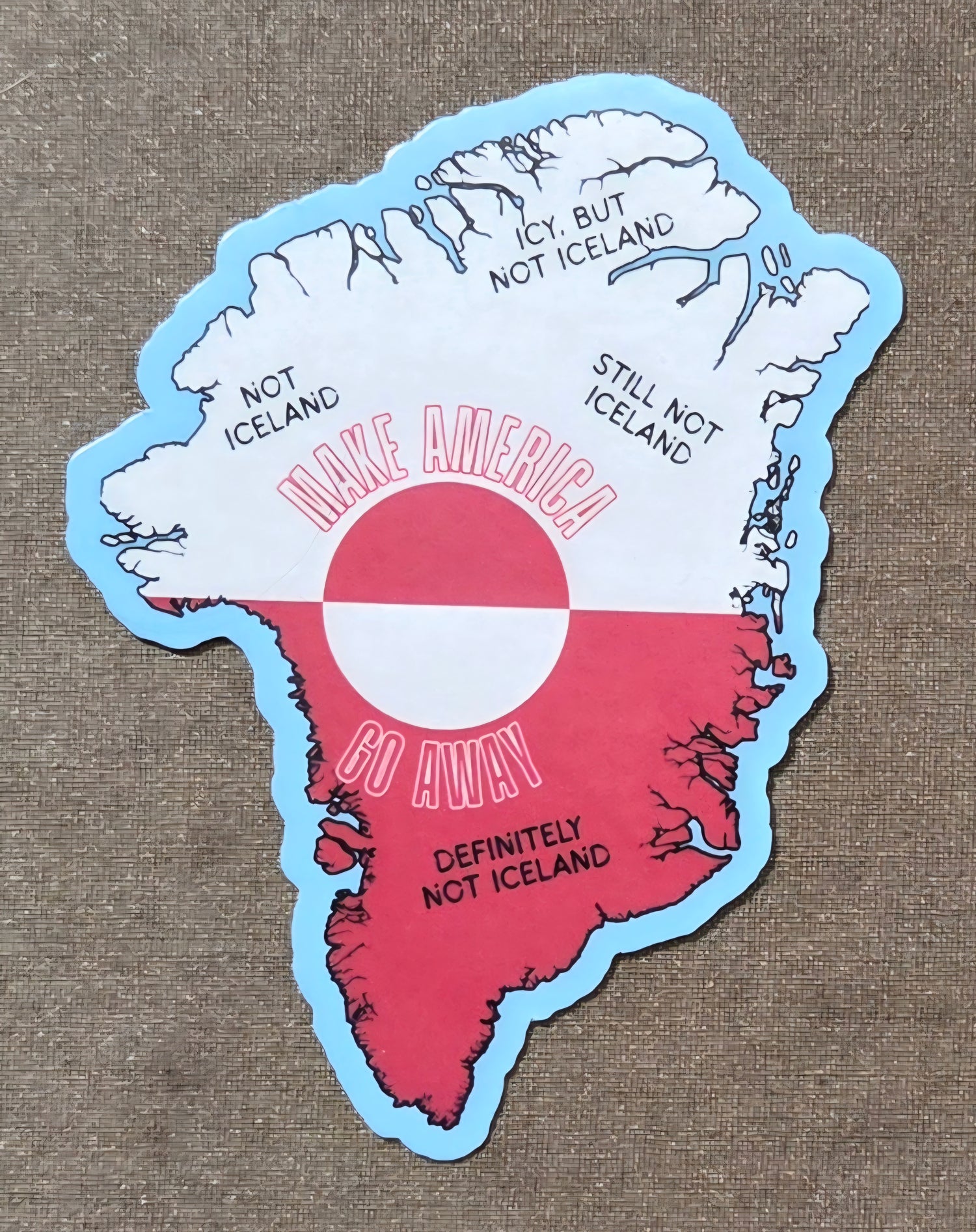 Map-shaped sticker with text on a textured background